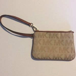 Small leather and canvas wristlet